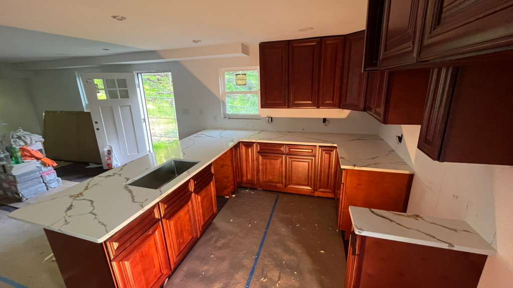 Solid cherry wood cabinetry brings warmth, character, and lasting craftsmanship to this thoughtfully designed kitchen.