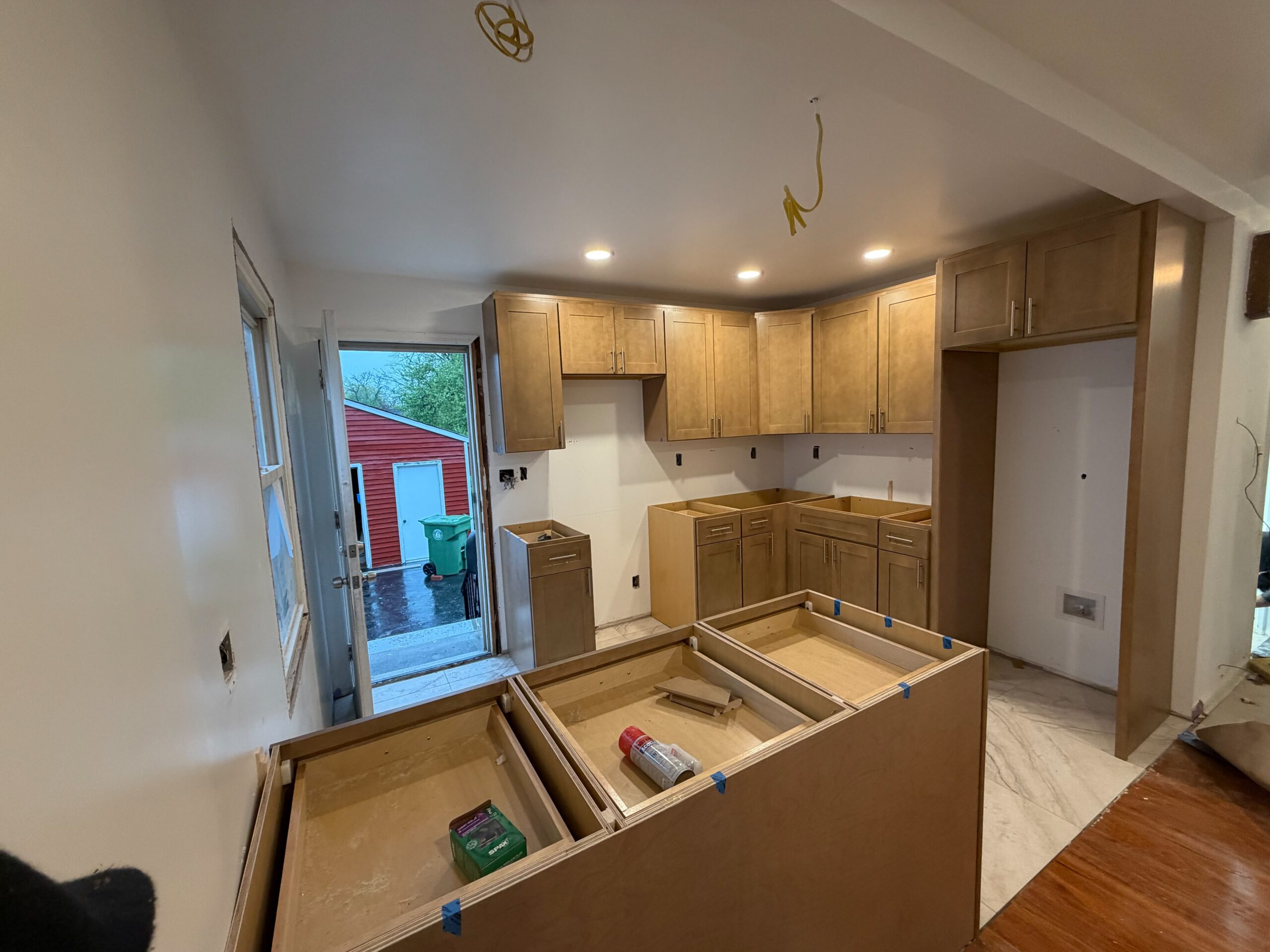 A beautifully crafted kitchen featuring solid wood maple cabinetry, Shaker-style doors, soft-close hardware, and thoughtful storage solutions.
