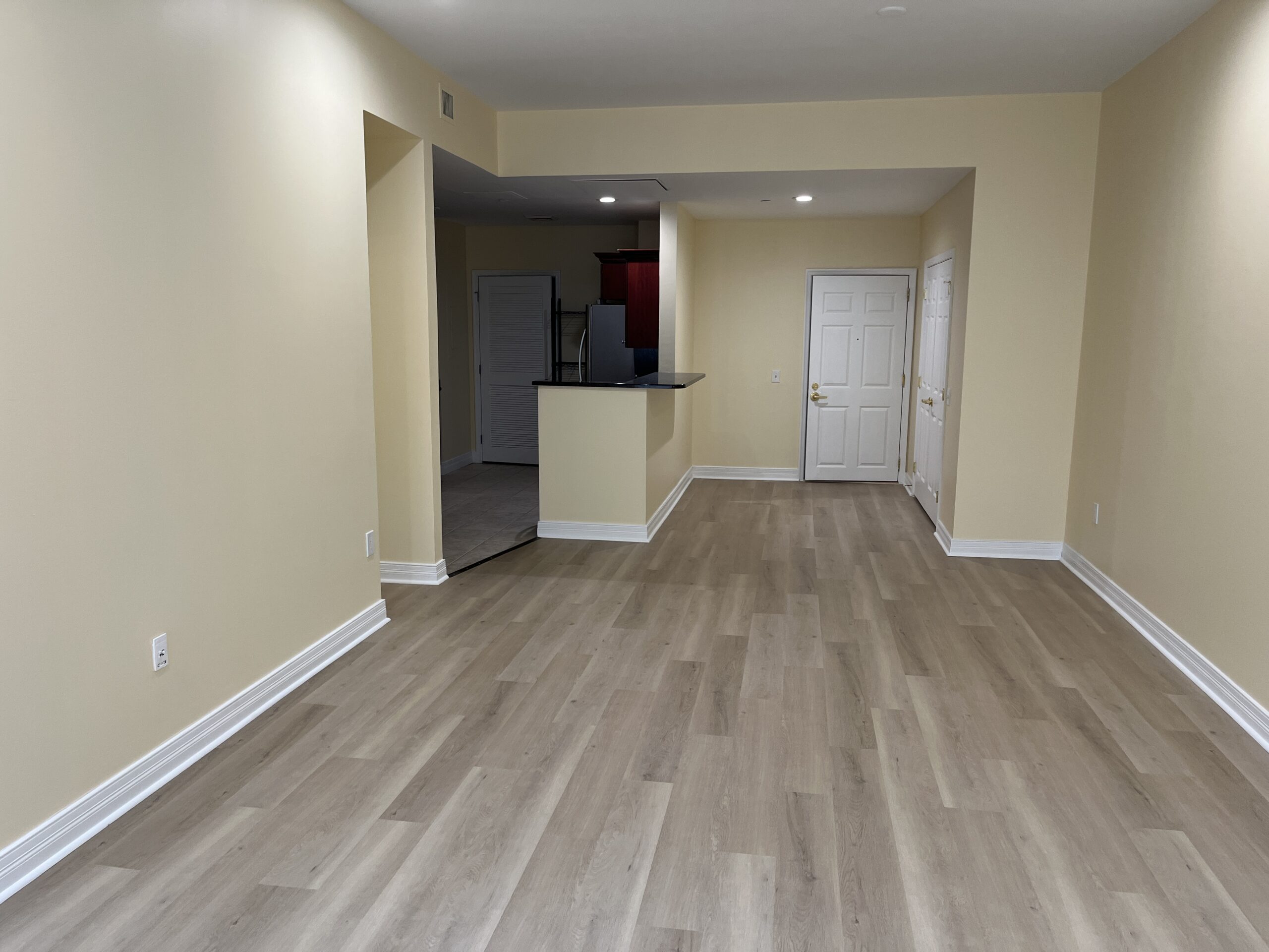 A complete interior renovation with new paint, hardwood flooring, and luxury vinyl plank flooring designed to refresh and modernize the home.