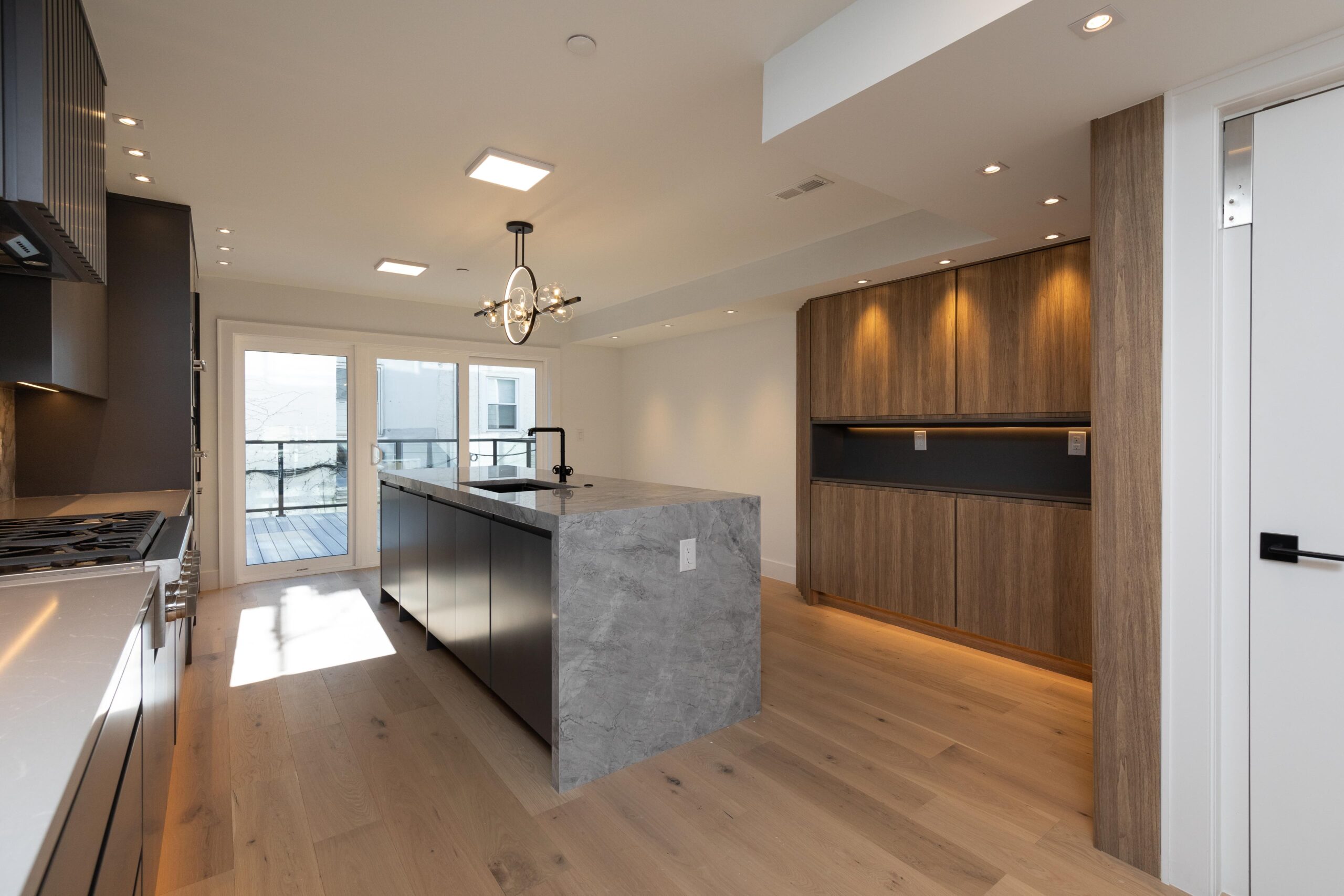 A custom modern kitchen designed and built for a new construction home, combining clean lines, premium materials, and exceptional craftsmanship.